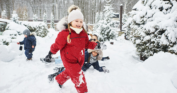 Kids playing outside in snow